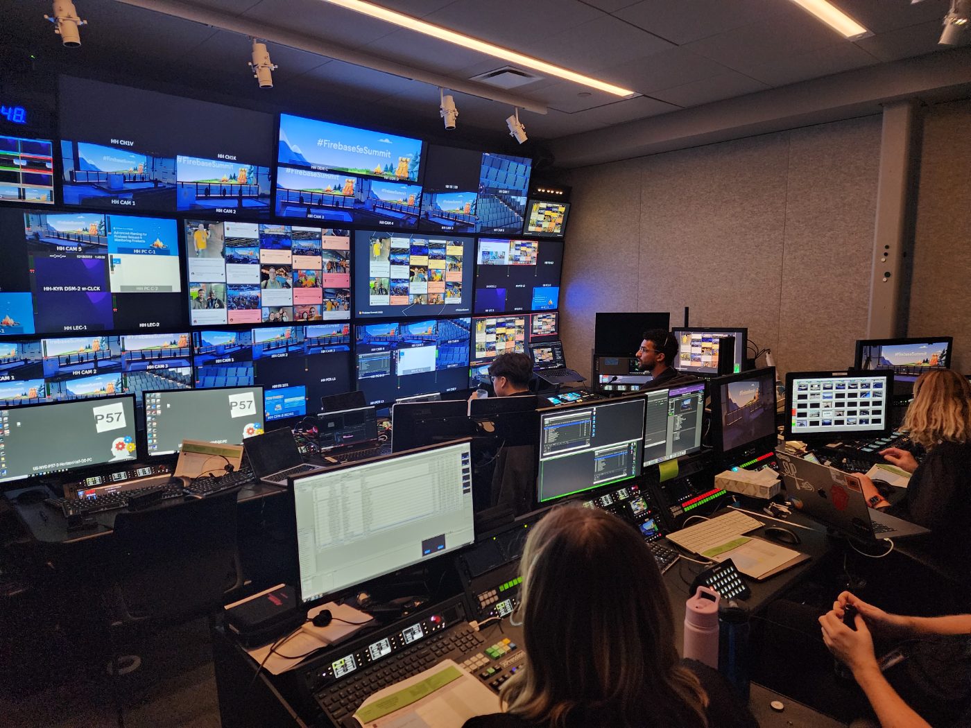Corporate conference stage and A/V setup with an event sponsor screen